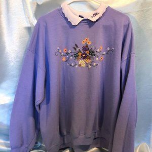 grandma chic purple sweater with embroidered flower detail
